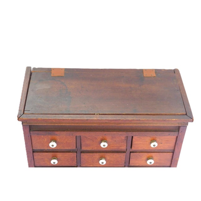 Pennsylvania Apothecary / Spice Cabinet, c. 1850, likely in cherry, top compartment with newer leather hinge straps,...