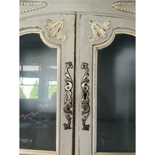 You will love this French blue/grey hand-painted antique cupboard. With stunning carved details, this piece dates from the...