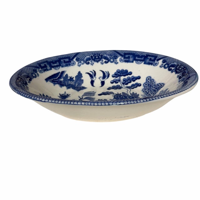 Mid century blue willow pattern serving bowl. Nice deep blue color with some bleed through on the underside. Has a repair...
