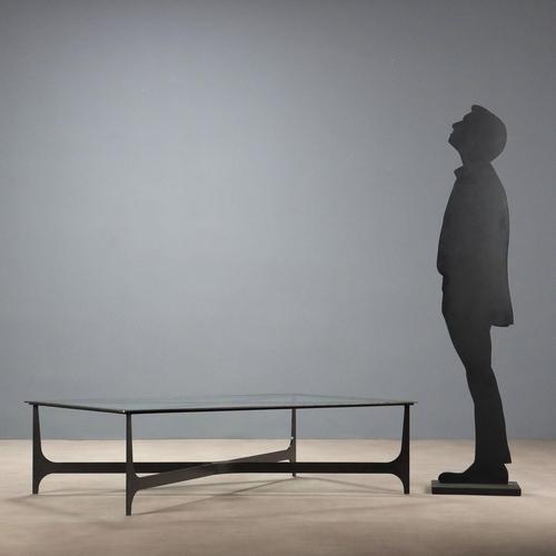 Black lacquered iron coffee table. Glass top set in an iron frame supported by four legs joined by a crosspiece. Italy,...