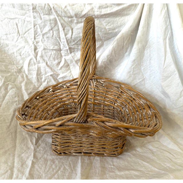 Vintage Wicker Gathering Basket with a whitewash throughout. Perfect for flowers or gathering Easter eggs. 20.5in w x...