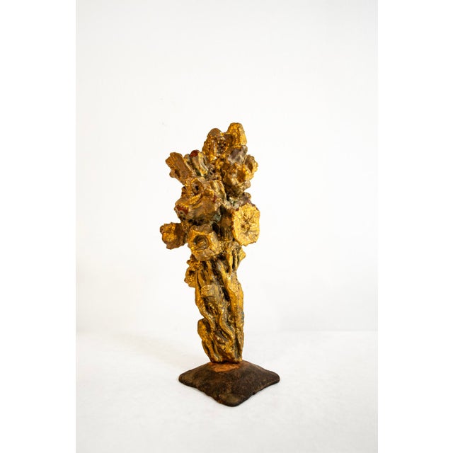 Fire-gilded terracotta sculpture with a wrought iron base. Signed by Pozzi 1950s This piece has an attribution mark, I am...