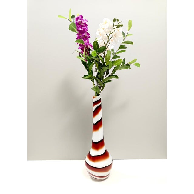 Made in Italy, 1970s. Made in heavy hand-blown Murano glass with bent strips with a double encasing (internal and...