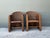 This pair of vintage woven rattan lounge chairs combines a sculptural silhouette with the relaxed, natural warmth that...