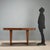 1940s table in burl veneer wood, featuring a simple and essential design typical of the period. The tabletop finish has...