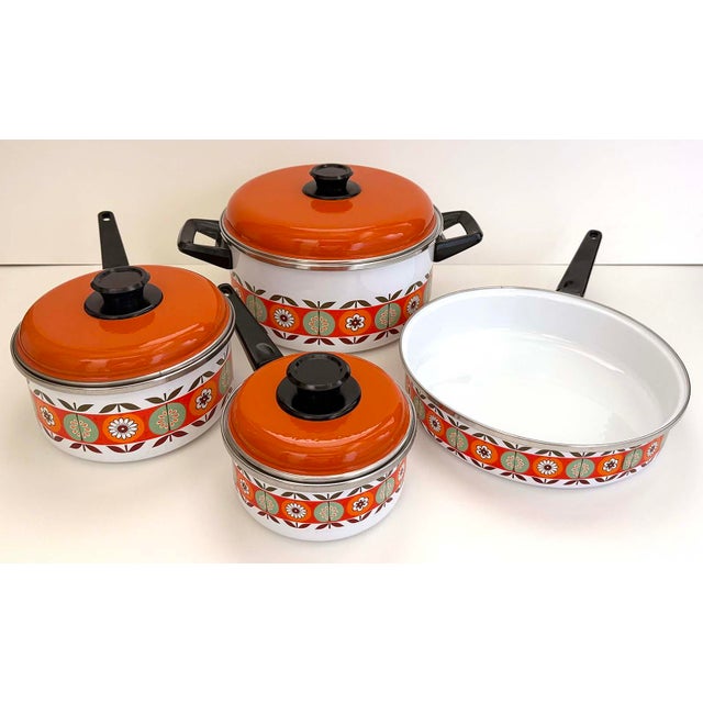 Vintage 7 piece set with colorful flower and fruit design. Set contains 4 pots and 3 lids. Stock pot measures 10 inches...