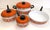 Vintage 7 piece set with colorful flower and fruit design. Set contains 4 pots and 3 lids. Stock pot measures 10 inches...
