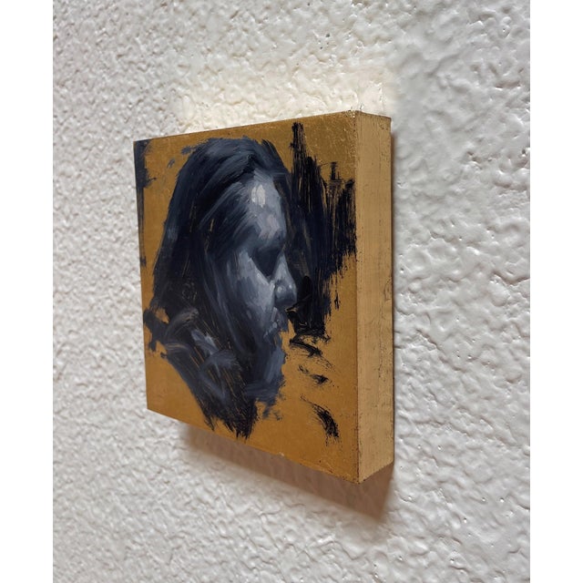 This oil on copper leaf piece presents a striking profile of a figure, rendered in deep, moody tones that contrast with...