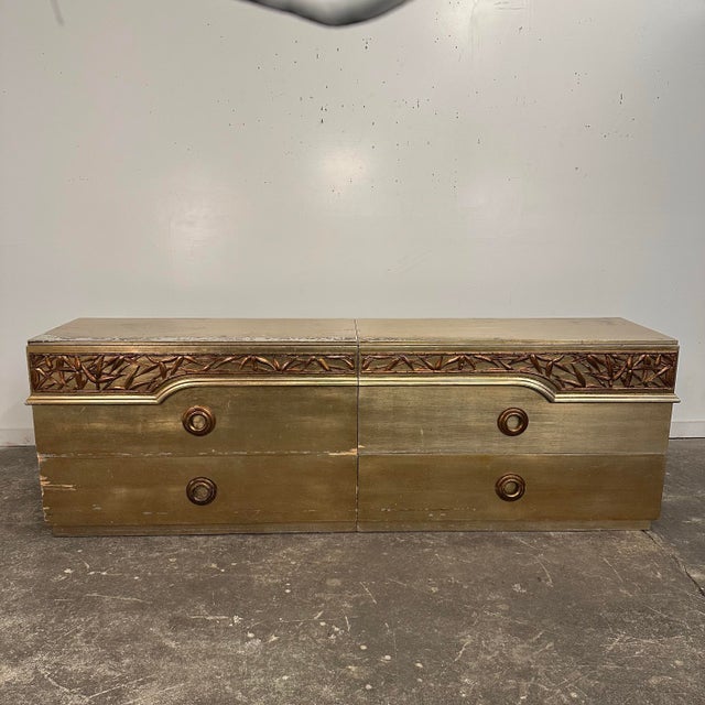 James Mont gold and silver leafed 2 piece dresser circa 1940s. This large dresser features 6 total draws with lots of...