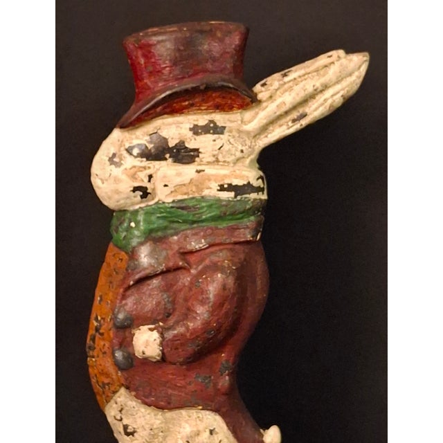 This whimsical cast iron doorstop depicts a dapper gentleman rabbit—frequently associated with John Tenniel’s iconic White...