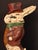 This whimsical cast iron doorstop depicts a dapper gentleman rabbit—frequently associated with John Tenniel’s iconic White...