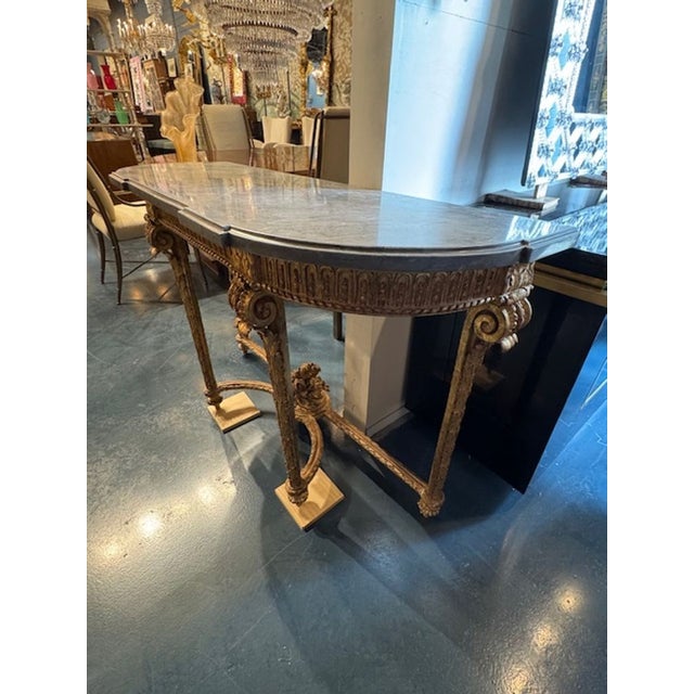 19th century Italian carved and giltwood Louis XVI style console. Italy embraced the French neoclassical vocabulary with...