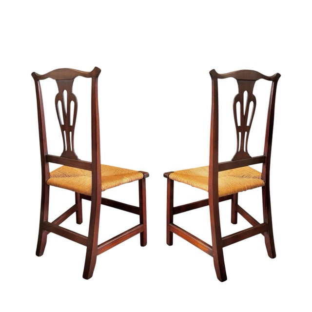 American Circa 1780 A pair of mahogany country Chippendale side chairs with rush seats; each retaining an original finish...