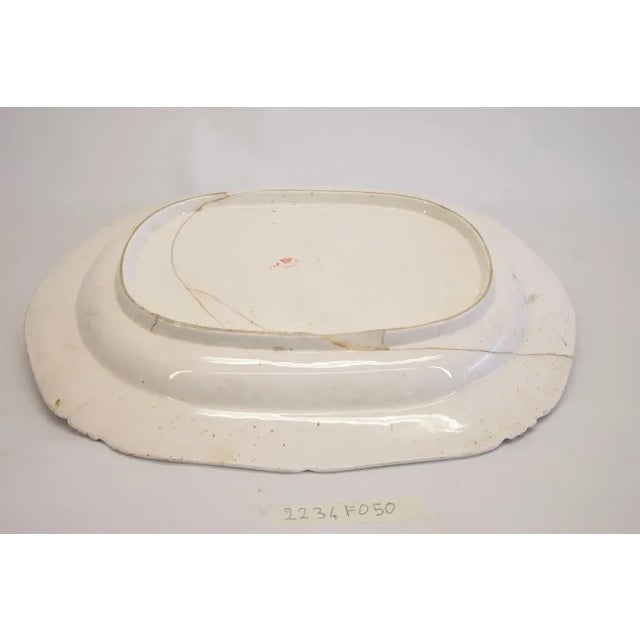 Large serving dish with purple-red rim and a golden star in the center, marked on the back "derby epoca 1800" (derby,...