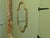 A Long Shaped Oval Brass Wall Mirror The Mirror has a decorative Acanthus Leaf motif around the brass Mirror frame The...