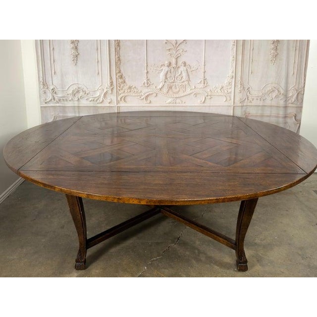 A masterclass in both form and function, this exceptional dining table marries Old World craftsmanship with ingenious...