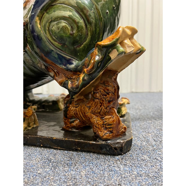 Incredibly intricate majolica foo dogs of vibrant color and true antiques! Heavy sculptures that will make a statement in...