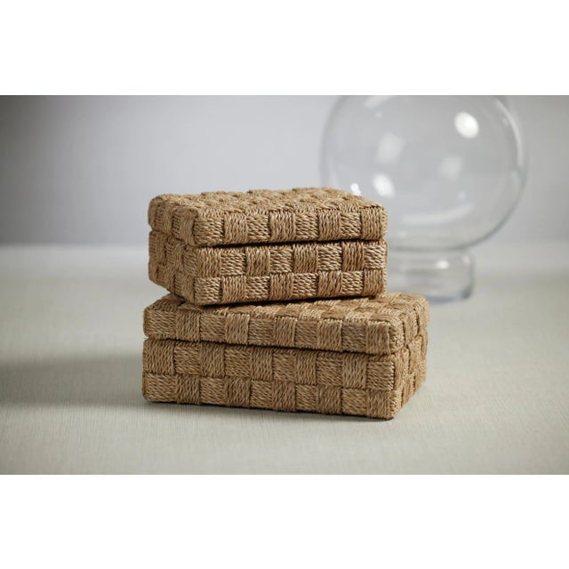 Abaca rope has been neatly woven to craft this unique decorative box that is as cool as an ocean breeze. The lattice work...