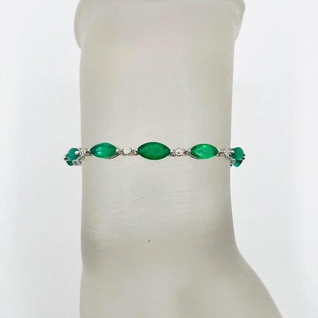 Gorgeous 8.92 ct. emerald marquise and good quality white diamond rounds. Handmade in 18k white gold. Length is 7.5".