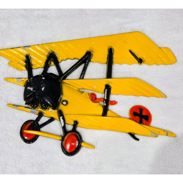 Bring retro charm and bold color to your space with this set of three vintage wall art plaques, featuring iconic WWI...