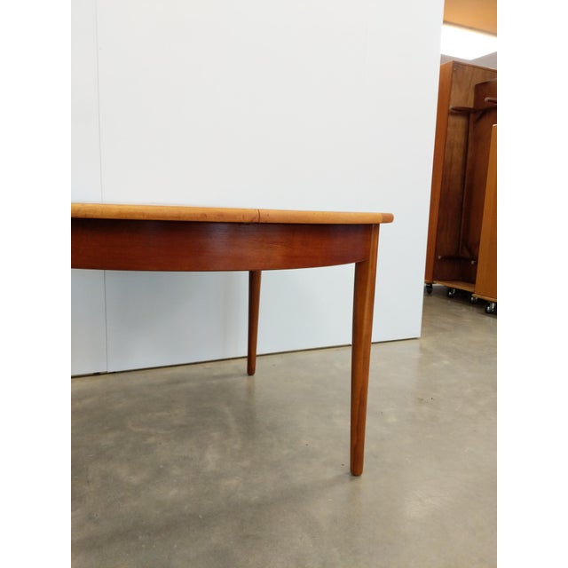 Authentic vintage mid century modern teak extendable dining table with 1 built-in leaf. This piece is in excellent...