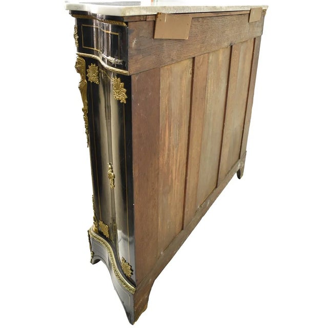 The Antique French Style Marble Top Two Door Cupboard is a stunning piece of antique furniture with a black marble top and...