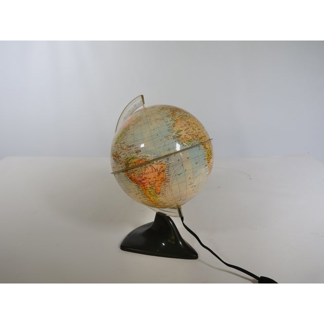 Space Age illuminated globe by Marco Polo for Südwest Verlag, 1963. The illuminated globe displays geographical and...