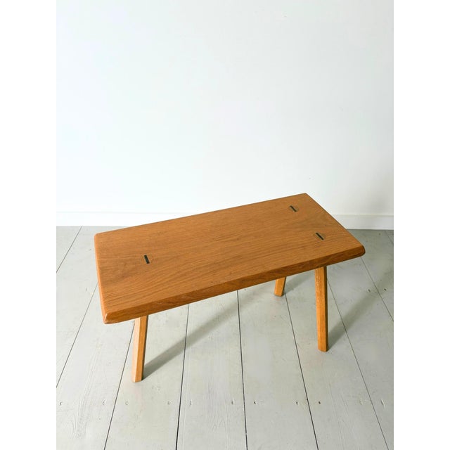 A beautifully crafted side table or stool with a minimalist aesthetic. This late 20th century piece is constructed in oak...