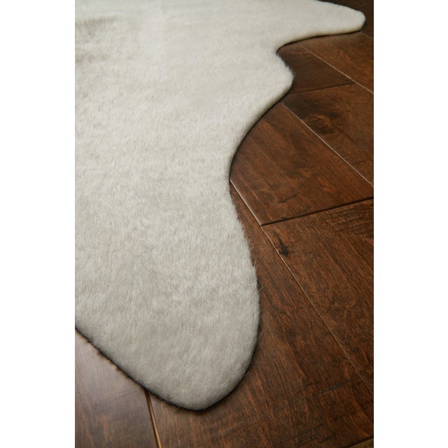 The Grand Canyon is a contemporary rug made in China from woven synthetics. The captivating look and colors are sure to...