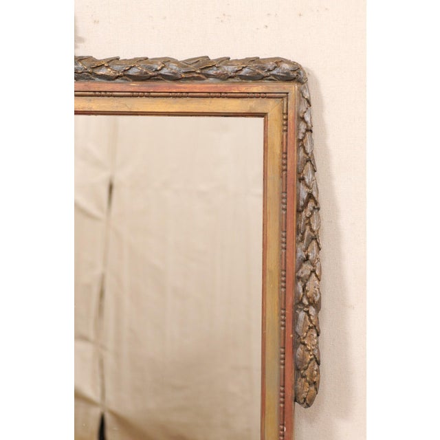 This vintage mirror, by American creator/manufacturer Niermann Weeks, has been designed in a Swedish Neoclassical style....