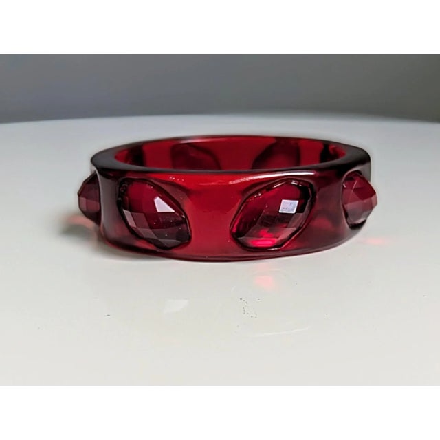 Seller delegated shipping, arrives 4-8 days from purchase. 90s sculptural studded acrylic bracelet in Ruby Red.