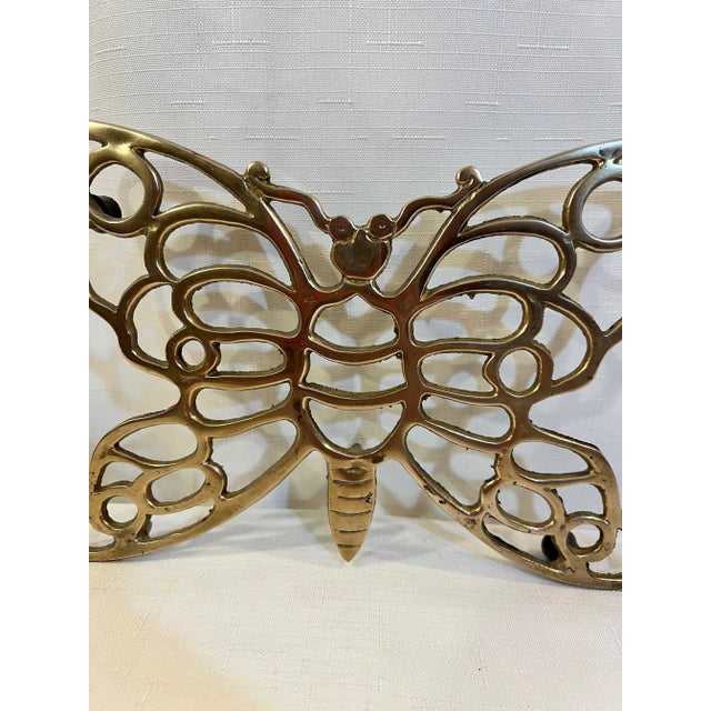 Welcome to Turtle and Crane! Let us tell you about this exquisite Vintage Butterfly Trivet in the style of Virginia...