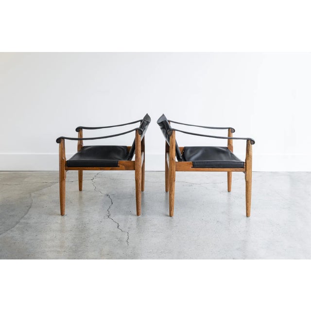 Gorgeous pair of safari sling lounge chairs designed by Douglas Heaslet for Brown Saltman. Constructed of solid oak, and...