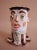 Petite porcelain vase with incredible detail work. Features expressive, wacky face with carefully crafted protruding eyes,...