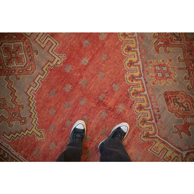 :: Oversized center medallion with interior simplistic geometric outwardly directed bouquet of serrated vines, minor...