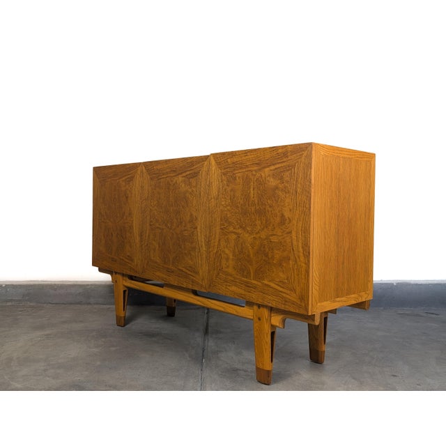 A rare and exceptional Edmond J. Spence buffet/credenza from the celebrated "Coronation" line, dating to the 1950s. This...