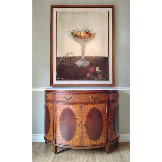 This beautiful console table is made by Ethan Allen in the Townhouse collection. It is made with mahogany and swirl-...