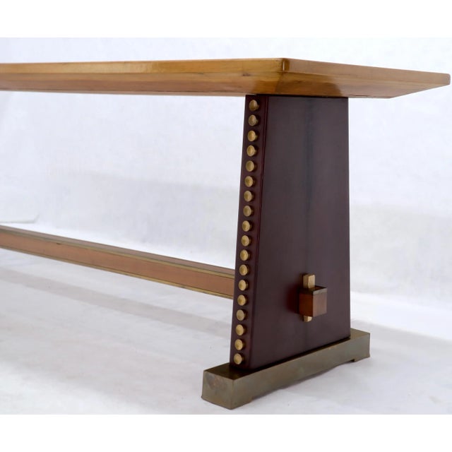 Thick top stretcher base studio made decorated in leather brass and studs long and narrow dining harvest table. Matches...