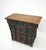 This 18th century antique elm coffer features a silhouette characterized by three upper drawers and a spacious two-door...