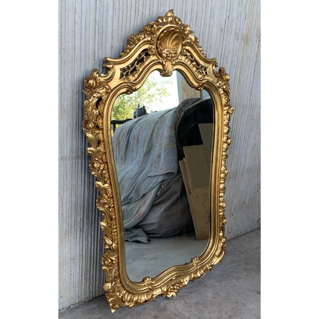 Early 20th French Empire period carved gilt wood rectangular mirror with crest An exceptional matched pair of hand carved...