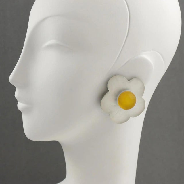 Harriet Bauknight for Kaso designed those gorgeous white and yellow frosted lucite or resin clip-on earrings. They boast a...