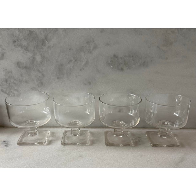 Set of 4 mid century vintage clear small cocktail glasses featuring rounded bowls and square bases in the style of Federal...