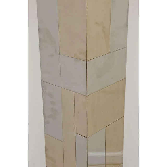 The patchwork or random tile patterning of the mixed metals of chrome-plated and brass-plated vintage cityscape Paul Evans...