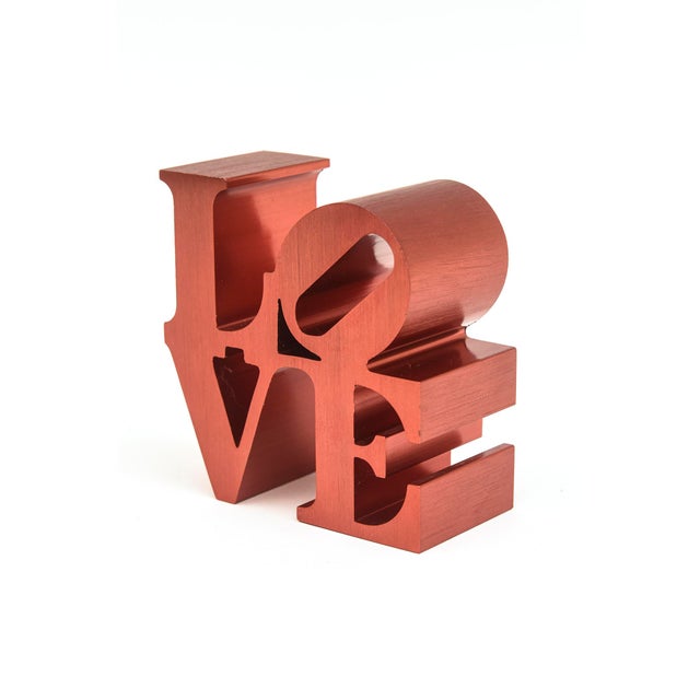 This very rare vintage rendition of the small Robert Indiana LOVE sculpture/ paperweight is rarely seen in this red...