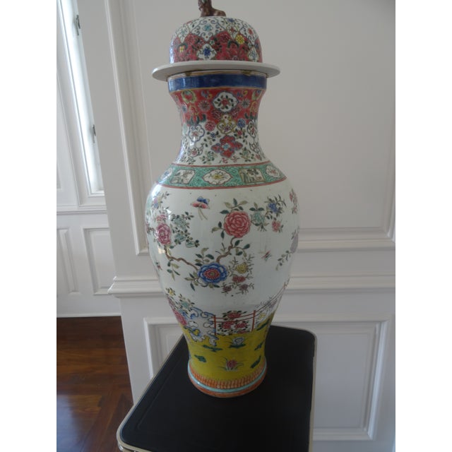 A beautiful covered jar with foo dog on top well decorated from the 20s.