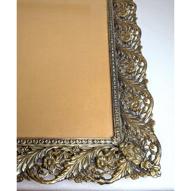 This vintage ornate metal frame has a wonderful antiqued (patinaed) brass finish and is typical of the mid-20th century...