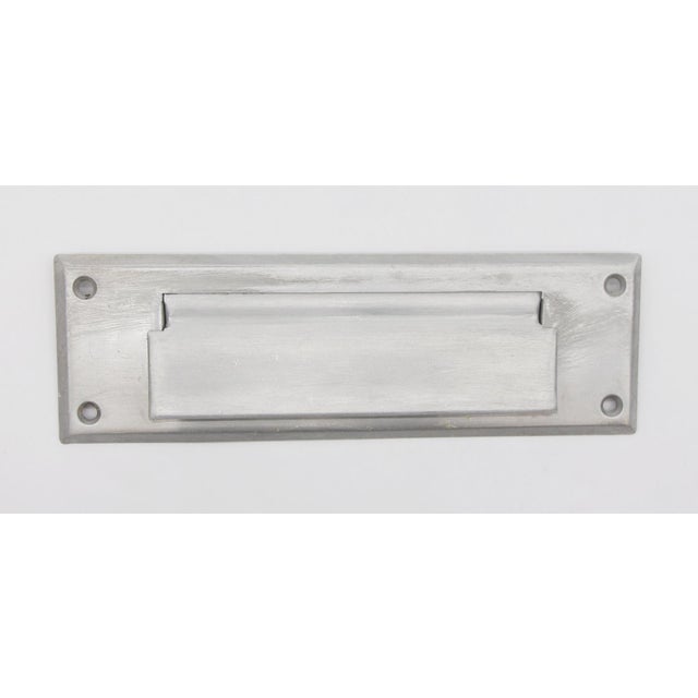 Modern brushed aluminum mail slot with matching back. Priced as a set. The manufacturer and exact date of creation are...