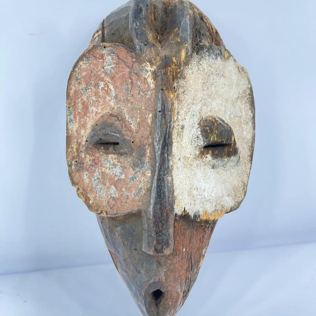 The Bembe Helmet Mask is a captivating cultural artifact originating from the Bembe people of the Democratic Republic of...