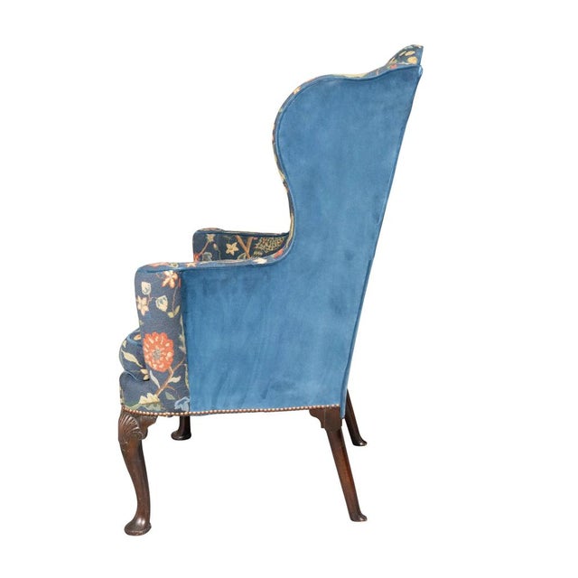 George II Mahogany Wing Chair. A fine chair with beautiful needlepoint. Wing back and scrolled arms. Loose cushion seat...