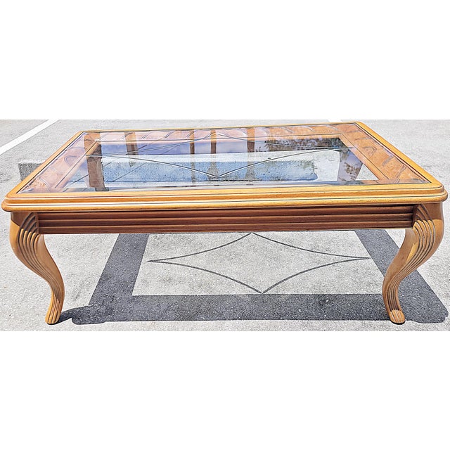 Classic and contemporary meet coastal combined in this carved mahogany coffee table, solid carved mahogany with an...
